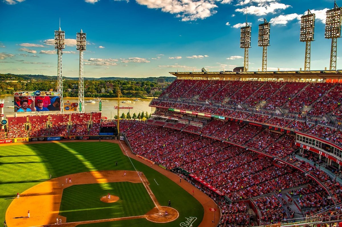 Packed ballpark crowd at sunset: tens of thousands of fans connected to venue Wi-Fi.